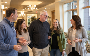 Jim and Amy with people - small